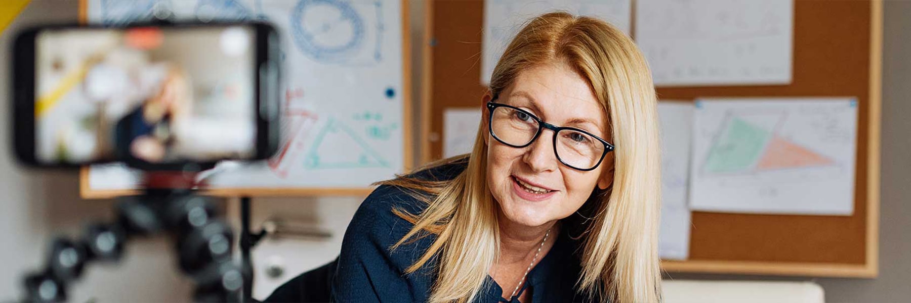 close up of teacher with remote equipment around her