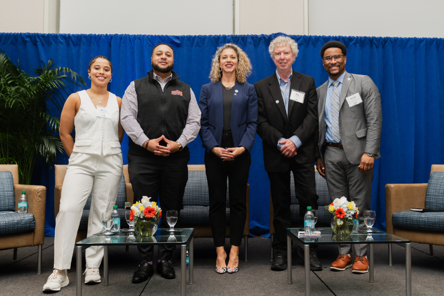 Beacon Discussion panelists stand on stage in the Campus Center Ballroom.