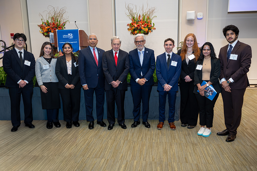Dean, Chancellor, Speaker and students standing at College of Management 50th Event