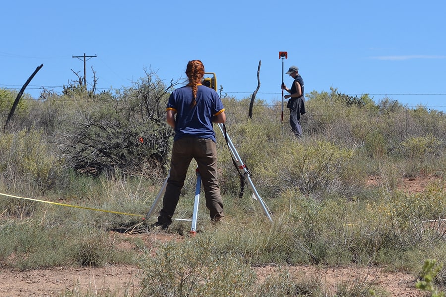 Graduate students Claire Norton and Mikayla Roderick mapping at Las Golondrinas, New Mexico. Photo by Heather Trigg