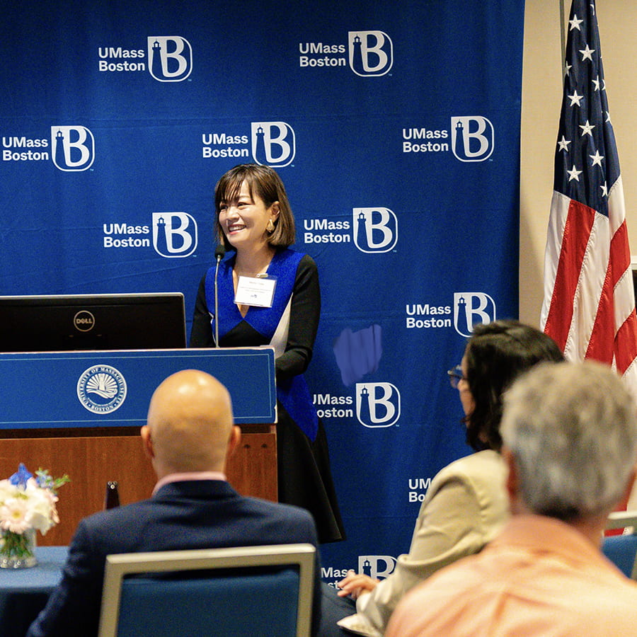 Professor at podium during faculty recognition awards.