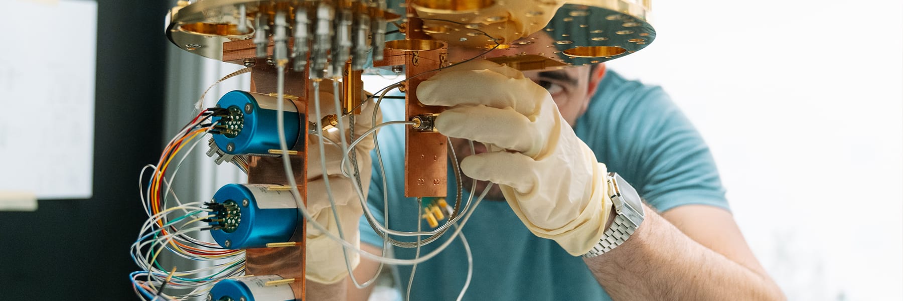 Student adjusts machine in a Core Facility lab.
