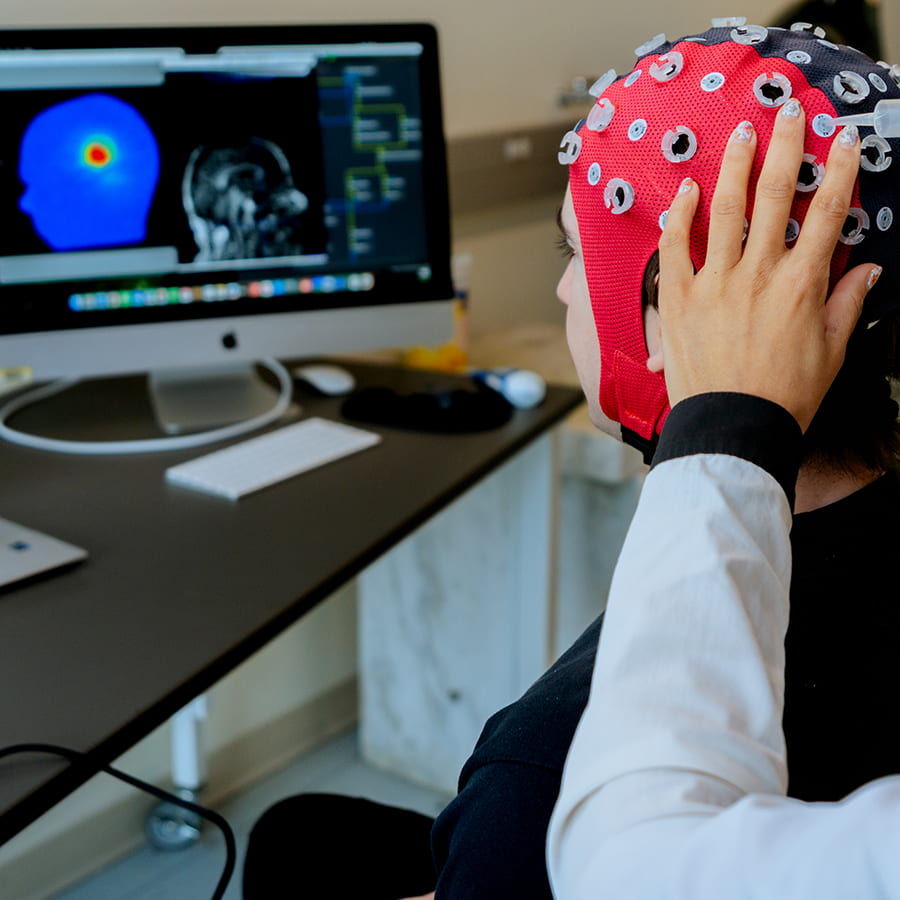 Sumientra Research lab with subject wearing a brain sensor cap.