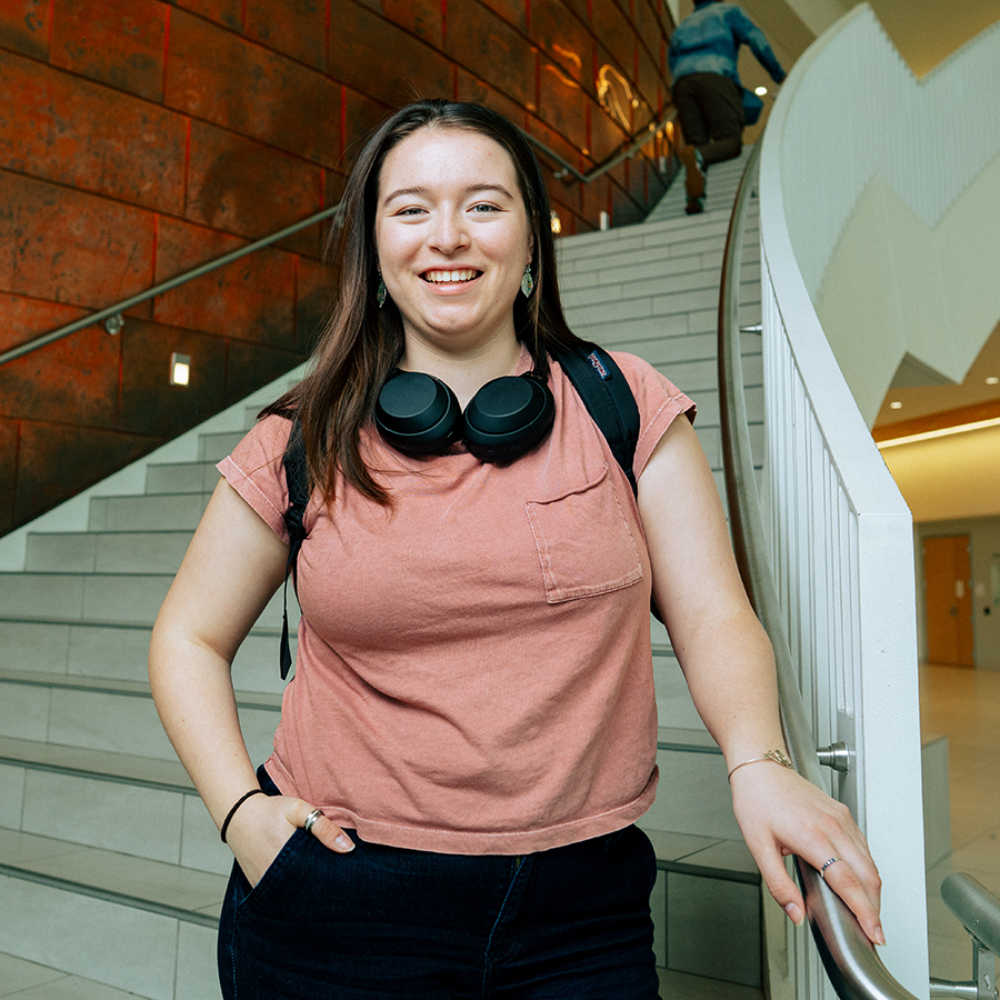 PhD student on stairs at University Hall